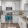 Open kitchen space with white cabinets, tile backsplash, island, and stainless steel appliances